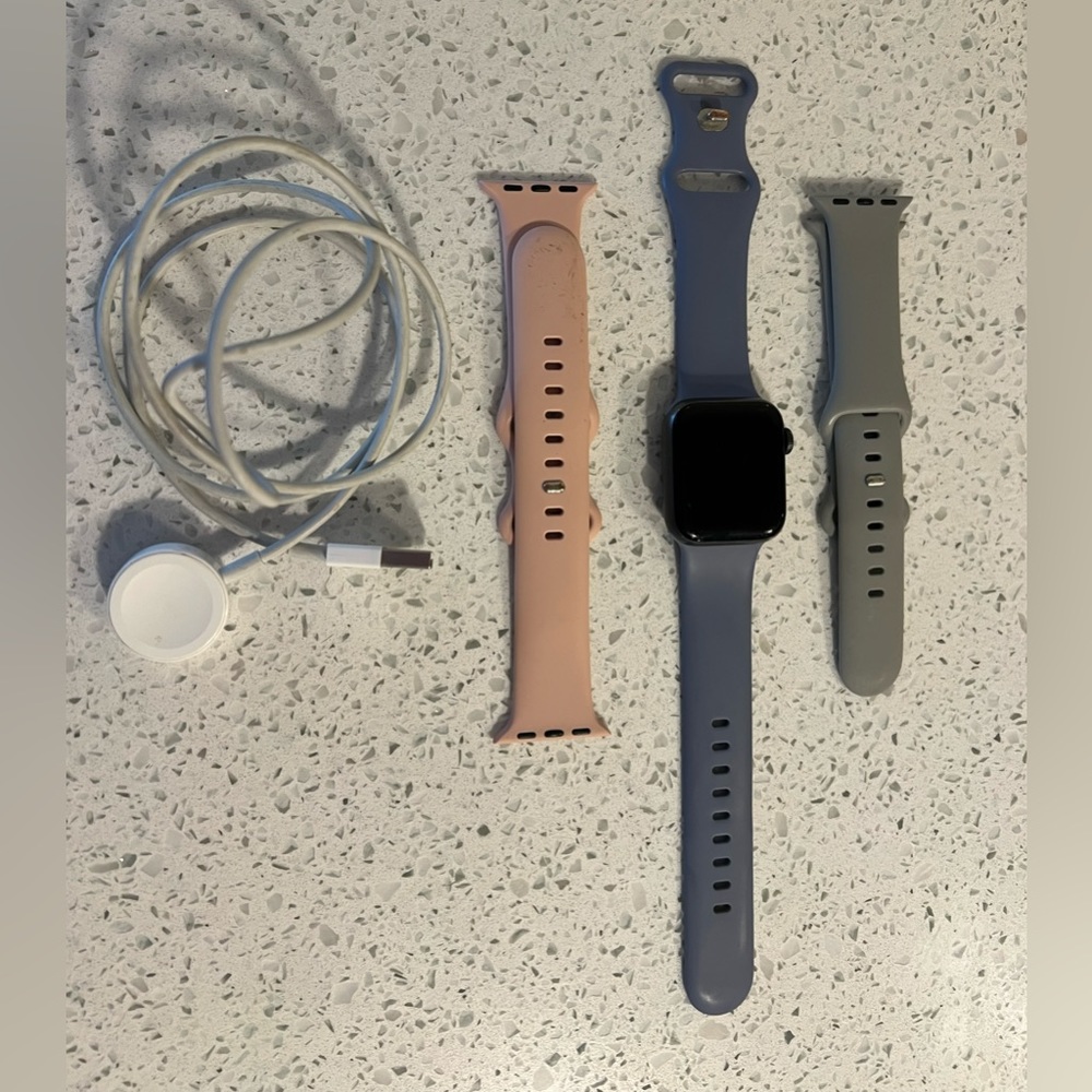 Apple Watch Series 4 with charger and extra bands
